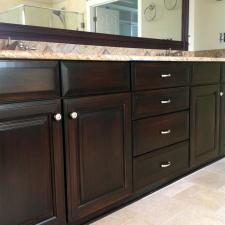 Here how this Brentwood TN customers master bathroom cabinet in faux mahogany wood glaze looks after makeover